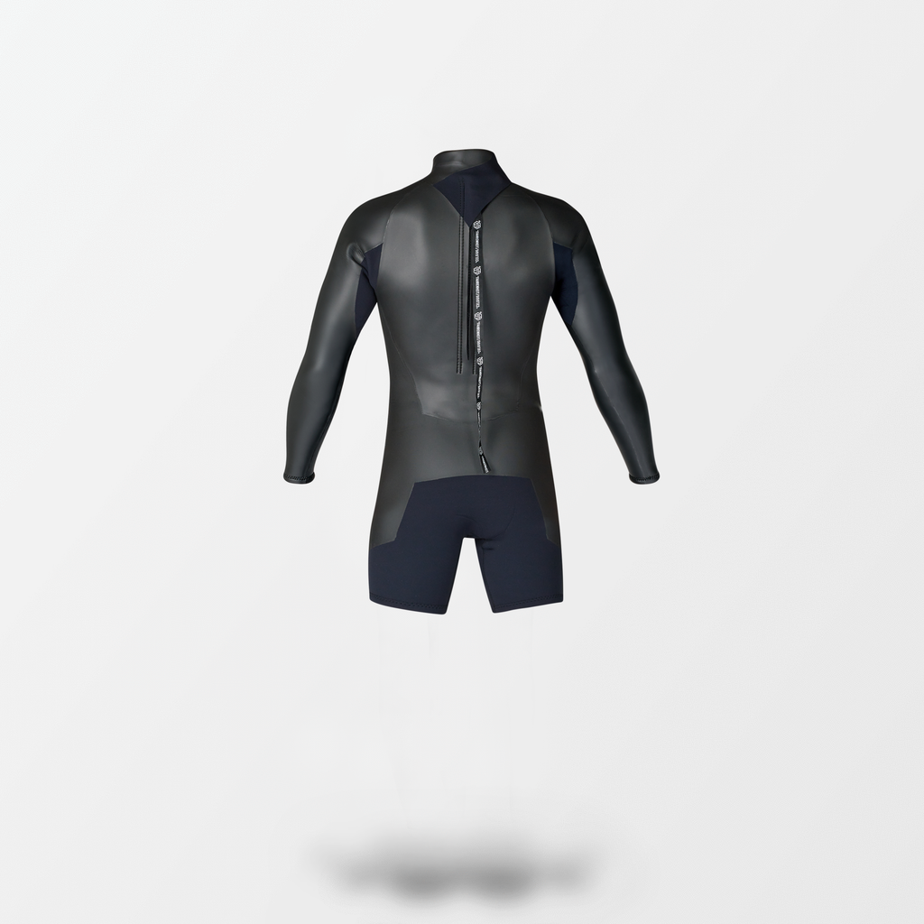 A black Japanese Spring wetsuit with Fahrenheit Celsius Wetsuits logo on the chest and a visible brand name, featuring a smooth 'rubber' outer layer.