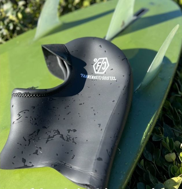 Hooldum Wetsuit Hood Fahrenheit Celsius on a surfboard